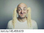 Surprised man with noodles hanging from his ears. Стоковое AI-изображение, AI-художник Дмитрий Киселёв / Фотобанк Лори