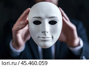 Man holds a white mask in front of him. Стоковое AI-изображение, AI-художник Дмитрий Киселёв / Фотобанк Лори