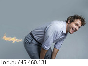 Male businessman with flames coming out of his butt. Стоковое AI-изображение, AI-художник Дмитрий Киселёв / Фотобанк Лори