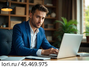 A businessman at his workplace with a laptop. Стоковое AI-изображение, AI-художник RamA / Фотобанк Лори