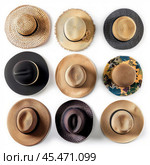 Fashionable hats hanging on a white wall. Стоковое AI-изображение, AI-художник Иван Рябоконь / Фотобанк Лори
