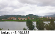 Панорама города Кымчхон в Северной Корее, КНДР. Пасмурный летний день (2024 год). Стоковое фото, фотограф Александр Кузнецов / Фотобанк Лори