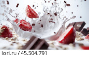 A dynamic and vibrant shot of fresh strawberries falling into milk. The splashing liquid creates a slow motion effect, making the composition lively and energetic. Drops of milk, chocolate pieces and cereal are scattered around the strawberries, adding texture and variety. Pieces of chocolate bars are visible in the background, which emphasize the sweet theme.The light background enhances the feeling of freshness, and the red color of the strawberries stands out against the snow-white milk, creating a strong visual contrast. The photo is ideal for advertising food products, desserts, yogurts or muesli, as well as for use in food blogs and on food packaging. Стоковое AI-изображение, AI-художник Анна Кривицкая / Фотобанк Лори