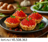 Tartlets with red caviar. A beautiful and original snack for a festive table. Enjoy your meal! Стоковое AI-изображение, AI-художник Сергей Елизарьев / Фотобанк Лори