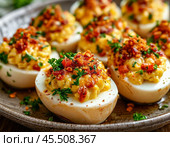 Stuffed eggs, a traditional appetizer for any holiday table, which is prepared quickly, simply and from a minimum amount of products. Enjoy your meal! Стоковое AI-изображение, AI-художник Сергей Елизарьев / Фотобанк Лори