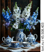 "Magic fountain" of beautiful delphiniums near the tea set. Стоковое AI-изображение, AI-художник Сергей Елизарьев / Фотобанк Лори