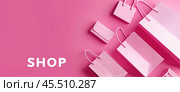 Розовый фон с сумками и надписью SHOP (Магазин) Стоковое AI-изображение, AI-художник Александр Жуков / Фотобанк Лори
