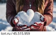 Women's hands in warm mittens hold a heart. Snow is falling. Valentine's Day and World Health, Love and Family Insurance Day. Стоковое AI-изображение, AI-художник Photojuli / Фотобанк Лори