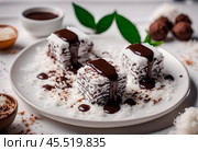 Side view of vegan lamingtons stacked on a ceramic plate, showing the sponge cake layers coated in chocolate and coconut. The plate is placed on a linen napkin on a wooden table, with crumbs and extra coconut flakes around for a casual, homemade feel. Стоковое AI-изображение, AI-художник Ирина Старикова / Фотобанк Лори