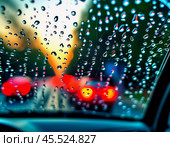 Raindrops cling to the surface of car glass, distorting a vibrant cityscape at evening, where colorful lights from traffic and buildings merge into a beautiful display. Generative AI. Стоковое AI-изображение, AI-художник Юлия Петровская / Фотобанк Лори