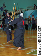 Nizhny Novgorod, Russia, 11.24.2024 Gagarin Avenue 25 d Russian Kendo Championship. Athletes in protective equipment with a sword and a protective helmet at competitions. Редакционное фото, фотограф Egor Sarantstv / Фотобанк Лори