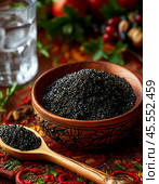 Black caviar in a wooden dish. A beautiful and original appetizer for a festive table. Enjoy your meal! Стоковое AI-изображение, AI-художник Сергей Елизарьев / Фотобанк Лори