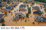 Flooded suburban houses during natural disaster from above. Стоковое AI-видео, аниматор Юрий Поздников / Фотобанк Лори