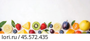 Fresh fruits arranged aesthetically on a white background for a vibrant display of colors and textures. Стоковое AI-изображение, AI-художник Сергей Толмачёв / Фотобанк Лори