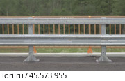 Metal, barrier, fence, road, repair, reflectors, металлическое, барьерное, ограждение, ремонт, дороги. Стоковое видео, видеограф Опока Алексей / Фотобанк Лори