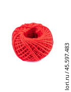 A roll of red jute twine placed on a white background, ideal for crafting, packaging, and DIY projects. Perfect for online stores or product catalogs showcasing eco-friendly materials. Стоковое фото, фотограф Татьяна Терехина / Фотобанк Лори