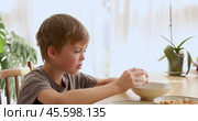 Boy refusing to eat boiled egg for breakfast. Стоковое видео, видеограф Ekaterina Demidova / Фотобанк Лори
