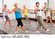 Group of active women practicing energetic dance in a studio. Стоковое фото, фотограф Яков Филимонов / Фотобанк Лори
