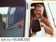 Jolly driver at the wheel of his car. Стоковое фото, фотограф Дмитрий Киселёв / Фотобанк Лори