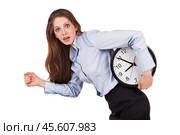 Woman in a hurry with the clock under his arm. Стоковое фото, фотограф Дмитрий Киселёв / Фотобанк Лори
