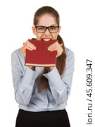 Girl biting teeth in the book cover. Стоковое фото, фотограф Дмитрий Киселёв / Фотобанк Лори