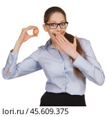 Surprised woman in glasses holding an egg. Стоковое фото, фотограф Дмитрий Киселёв / Фотобанк Лори