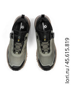KRASNOYARSK, RUSSIA - December 1, 2024: Beige Merrell sneakers on a white background. Редакционное фото, фотограф Плотников Дмитрий / Фотобанк Лори