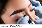 Microblading session with a specialist shaping and defining brows using professional tools. Стоковое AI-изображение, AI-художник Igor Tichonow / Фотобанк Лори