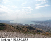 Panoramic view of Novorossiysk City and Tsemess Bay at sunrise. Morning cityscape of large port at Black Sea coast in Russia (2024 год). Стоковое фото, фотограф Фотограф / Фотобанк Лори