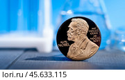 Moscow December 03 2024 Nobel Prize. Alfred Nobel Prize concept, Gold award with Nobel image. Physics, Chemistry, Literature, Peace Prize, Biology. Редакционное фото, фотограф Скрипачев Антон / Фотобанк Лори