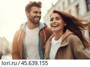 A cheerful couple strolls down a picturesque urban street, illuminated by warm sunlight. They share smiles and laughter, enjoying their time together in a vibrant atmosphere. Стоковое AI-изображение, AI-художник Sergey Grishin / Фотобанк Лори