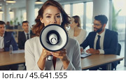 A businesswoman with a megaphone passionately speaking in an office environment as colleagues in the background observe. Стоковое AI-видео, аниматор Igor Tichonow / Фотобанк Лори