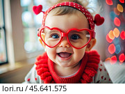 A cute little girl in stylish red heart-shaped glasses, having fun celebrating Valentine's Day. Стоковое AI-изображение, AI-художник Photojuli / Фотобанк Лори