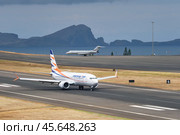 Smartwings Boeing 737 MAX 8 passenger plane taxi on runway in Cristiano Ronaldo Airport on Madeira island (2024 год). Редакционное фото, фотограф Дмитрий Рухленко / Фотобанк Лори