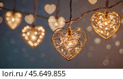 The concept of Valentine's Day, a banner with garlands in the form of hearts and magic lights for a holiday filled with love. A place for the text. Стоковое AI-изображение, AI-художник Photojuli / Фотобанк Лори