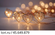 The concept of Valentine's Day, a banner with garlands in the form of hearts and magic lights for a holiday filled with love. A place for the text. Стоковое AI-изображение, AI-художник Photojuli / Фотобанк Лори