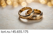 Gold wedding rings on a white background with a side. Wedding rings. The wedding day. The newlyweds. Стоковое AI-изображение, AI-художник Photojuli / Фотобанк Лори