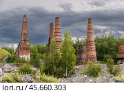 Pipes of old lime kilns on the abandoned marble and lime factory on a frosty January morning. Ruskeala, Karelia. Russia. Стоковое фото, фотограф Ольга Сейфутдинова / Фотобанк Лори