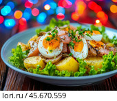 Norwegian salad: with salted fish, potatoes, egg, lettuce. Enjoy your meal! Стоковое AI-изображение, AI-художник Сергей Елизарьев / Фотобанк Лори