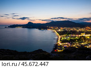 Beautiful view of the night embankment of the city of Sudak after sunset. South coast of the Crimean peninsula. Russia. Стоковое фото, фотограф Константин Лабунский / Фотобанк Лори