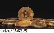Gold Bit Coin BTC Cryptocurrency Coins on a black background. Bitcoin is a worldwide cryptocurrency and digital payment system called the first decentralized digital currency. Стоковое видео, видеограф Андрей Армягов / Фотобанк Лори