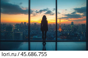 The silhouette of a young woman against the backdrop of a sunset sky over a metropolis. She stands at the panoramic windows of a skyscraper, immersed in her own thoughts. The tall building emphasizes her loneliness in the huge city. Стоковое AI-изображение, AI-художник Ярославский Максим / Фотобанк Лори