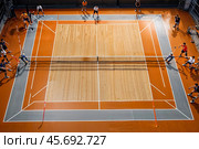 Professional volleyball courts with white lines, nobody. Crop photo of orange volleyball court in sport gym, sporty backdrop. Team game success, healthy sporty lifestyle concept. Copy ad text space. Стоковое AI-изображение, AI-художник Aleksandr Golubev / Фотобанк Лори