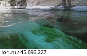 Ice cave on Baikal lake in winter. Стоковое видео, видеограф Михаил Коханчиков / Фотобанк Лори