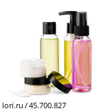 Variety of colorful personal care bottles and grooming accessories arranged on a white surface. Стоковое фото, фотограф Сергей Толмачёв / Фотобанк Лори