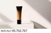 Minimalist beauty concept with unbranded foundation cream tube for cosmetic advertising and skincare design. Стоковое AI-изображение, AI-художник Sabyna75 / Фотобанк Лори