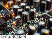 Electrolytic capacitors and resistors populating surface of circuit board. Стоковое AI-изображение, AI-художник Иван Рябоконь / Фотобанк Лори