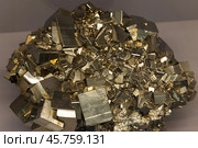 Druse of shiny cubic crystals. The mineral pyrite or iron pyrite. Стоковое фото, фотограф EugeneSergeev / Фотобанк Лори
