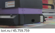 Modern Digital Large format UV printer. Printing production technologies. UV pinning is the process of applying a dose of low intensity ultraviolet light to a UV curable ink. Стоковое видео, видеограф Андрей Армягов / Фотобанк Лори