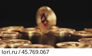 Gold Bit Coin BTC Cryptocurrency Coins on a black background. Bitcoin is a worldwide cryptocurrency and digital payment system called the first decentralized digital currency. Стоковое видео, видеограф Андрей Армягов / Фотобанк Лори